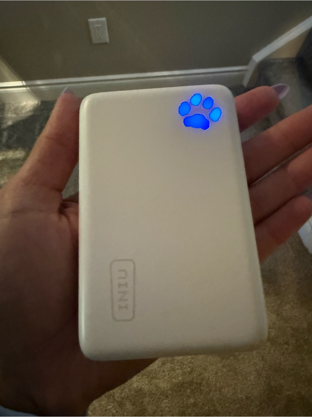 White Portable Power Bank with Blue Paw LED